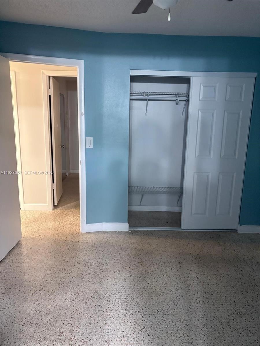 3821 Northwest 208th Street Miami Gardens, FL 33055 - Photo 18 of 23 an empty room with wooden door and mirror