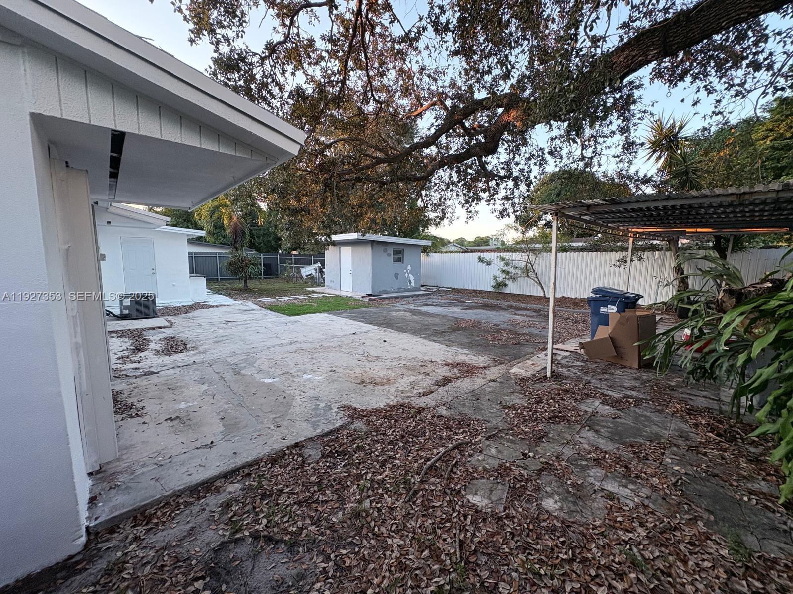 3821 Northwest 208th Street Miami Gardens, FL 33055 - Photo 21 of 23 a view of a house with a backyard