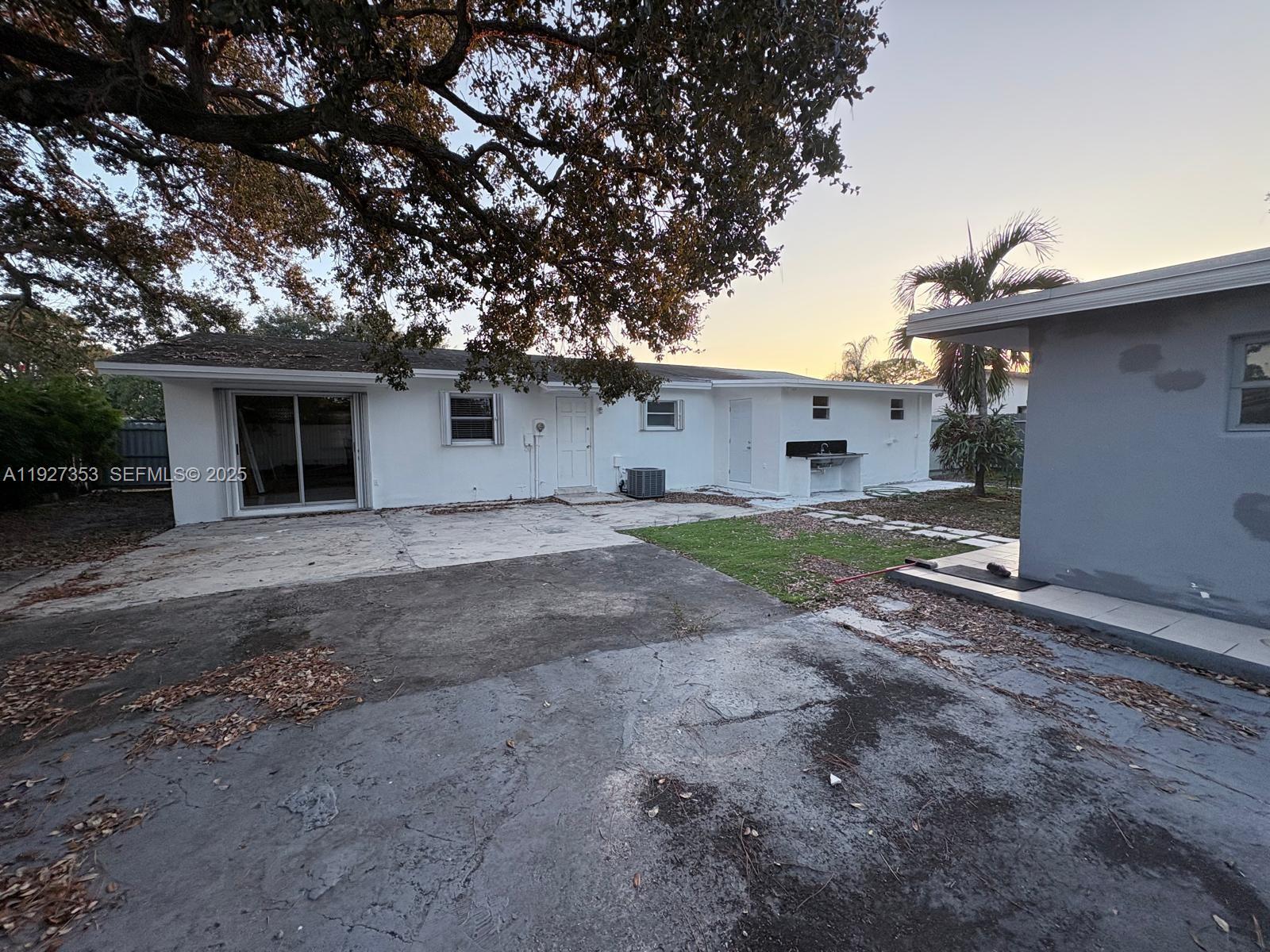 3821 Northwest 208th Street Miami Gardens, FL 33055 - Photo 22 of 23 a view of a house with a backyard