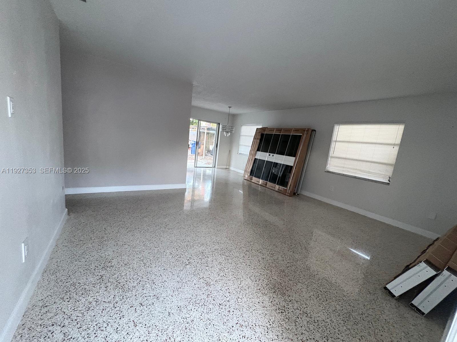 3821 Northwest 208th Street Miami Gardens, FL 33055 - Photo 7 of 23 a view of a livingroom with furniture and windows