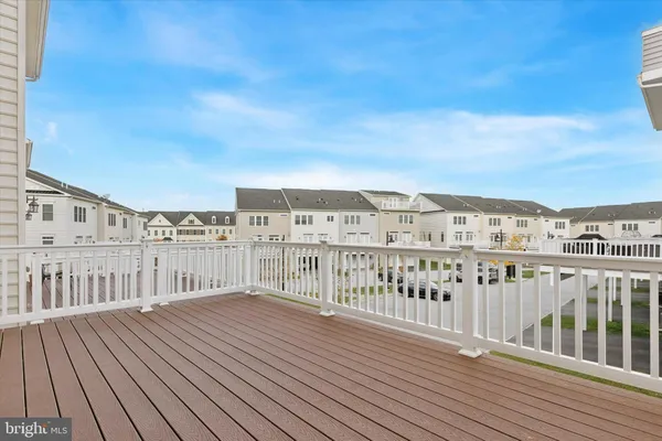 a view of balcony with wooden floor