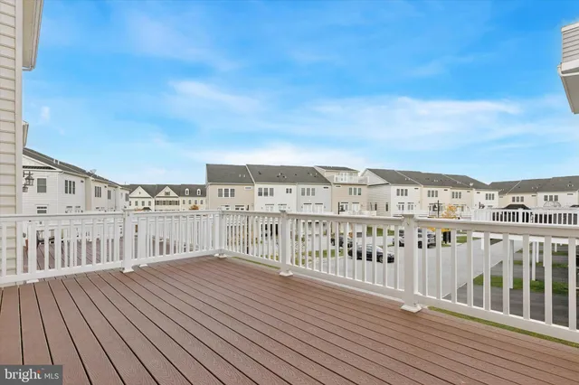 a view of balcony with wooden floor