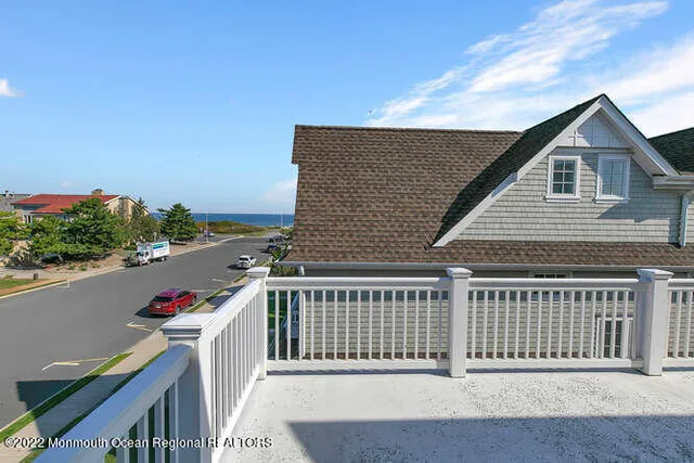 a view of a house with wooden deck