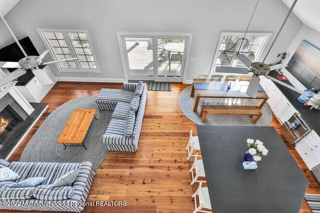 a view of living room with furniture and a fireplace