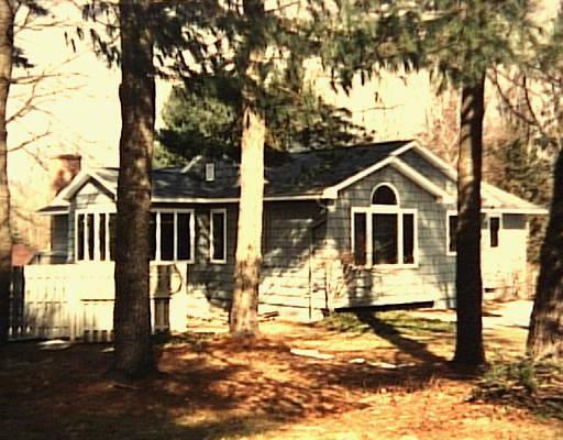 34 Arrowhead Road Wilton, CT 06897 - Photo 1 of 1 a front view of a house with a yard