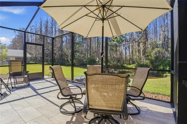 an aerial view of a house with outdoor space swimming pool outdoor seating