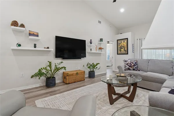 a kitchen with stainless steel appliances a stove microwave and a refrigerator