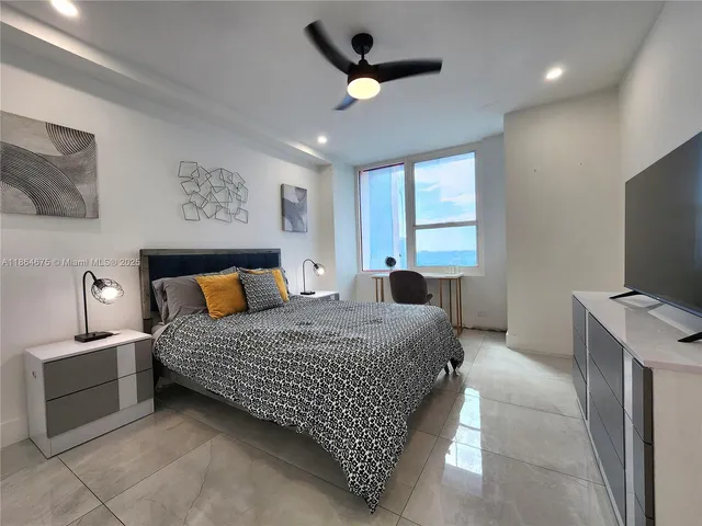 a bathroom with a toilet sink and shower