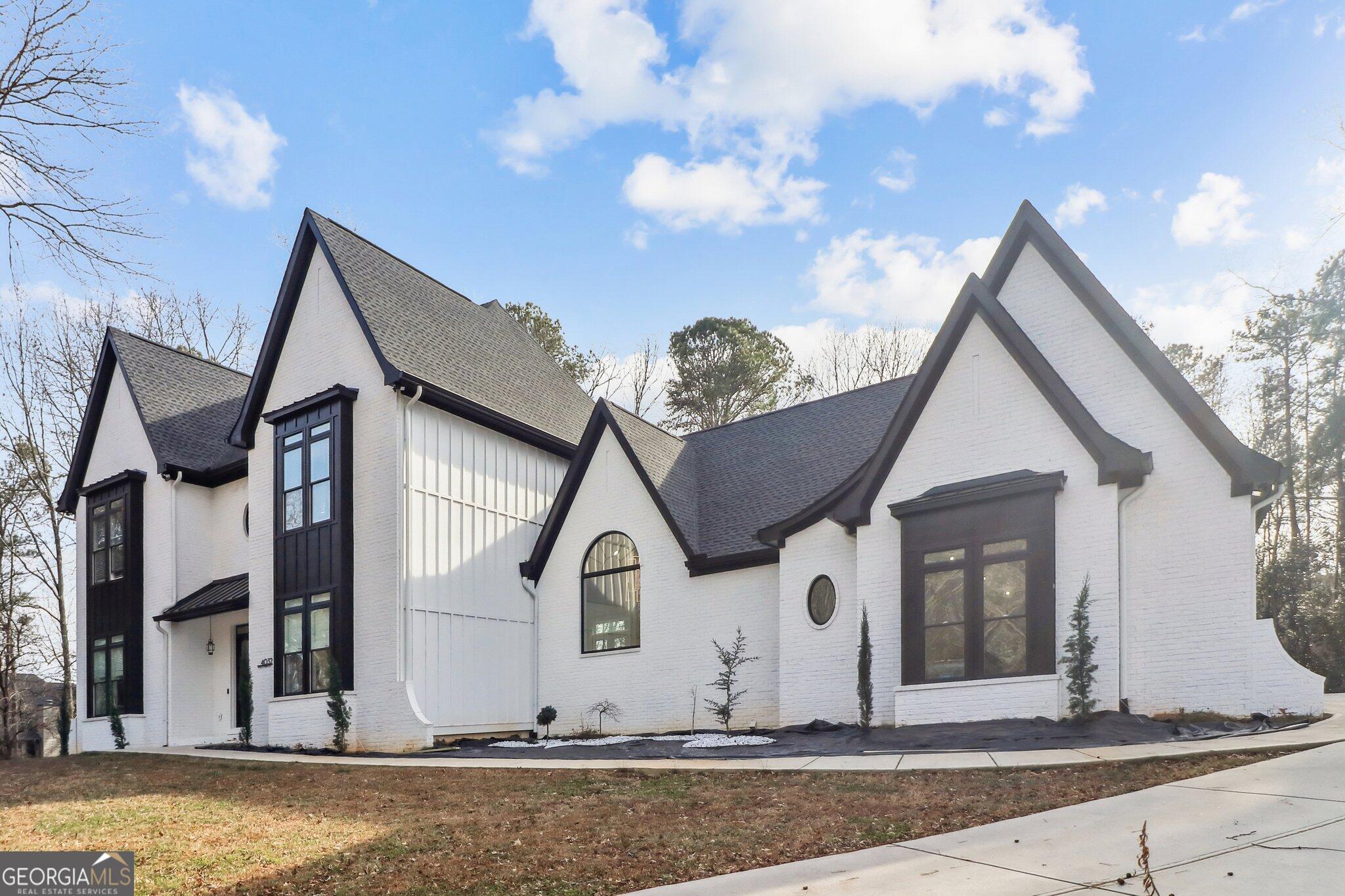 4032 Wesley Chapel Road Roswell, GA 30075 - Photo 1 of 36 a view of a house with a yard