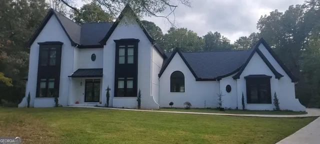 a front view of a house with a yard