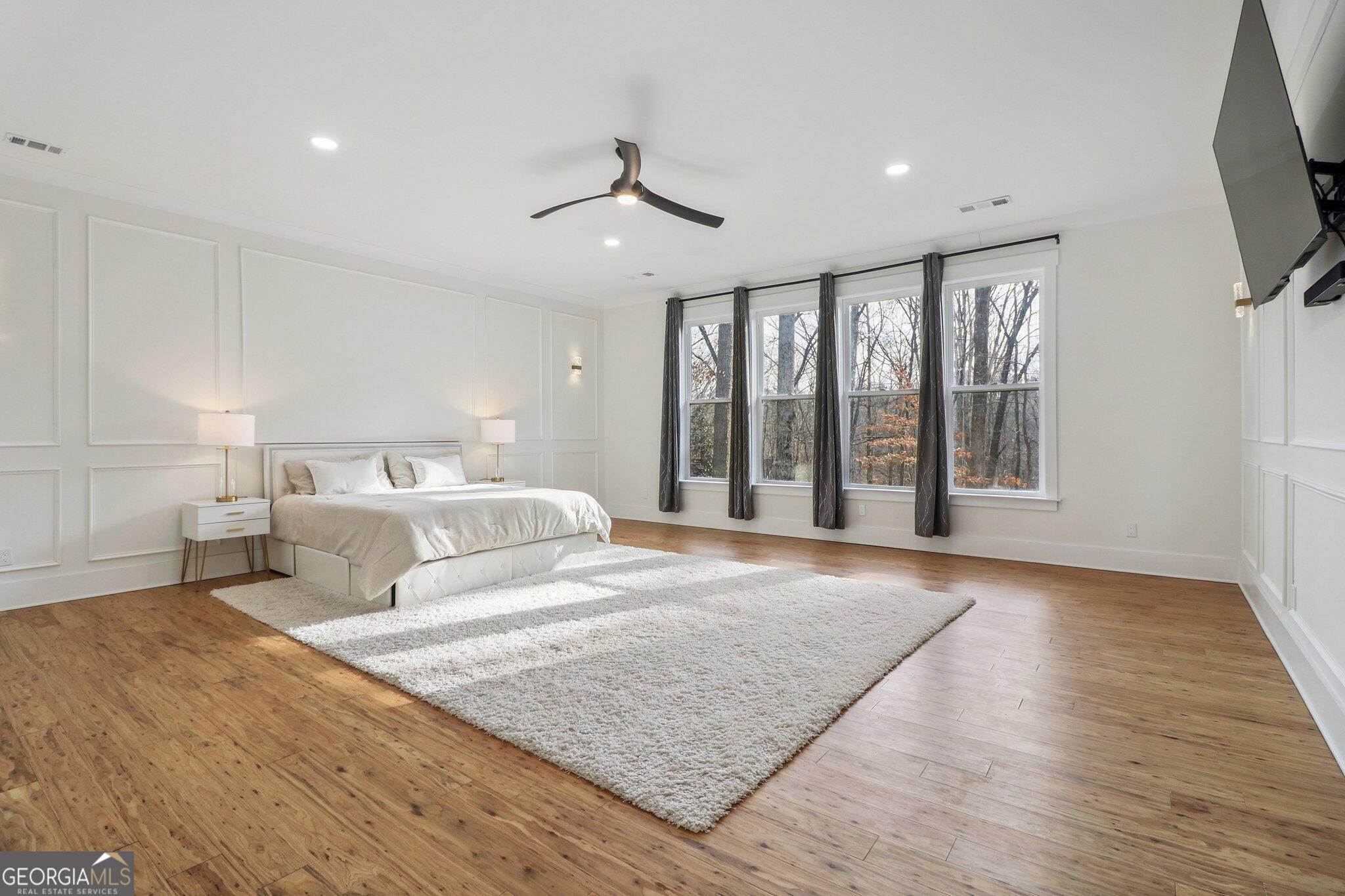 4032 Wesley Chapel Road Roswell, GA 30075 - Photo 11 of 36 a bedroom with a large bed and a large window