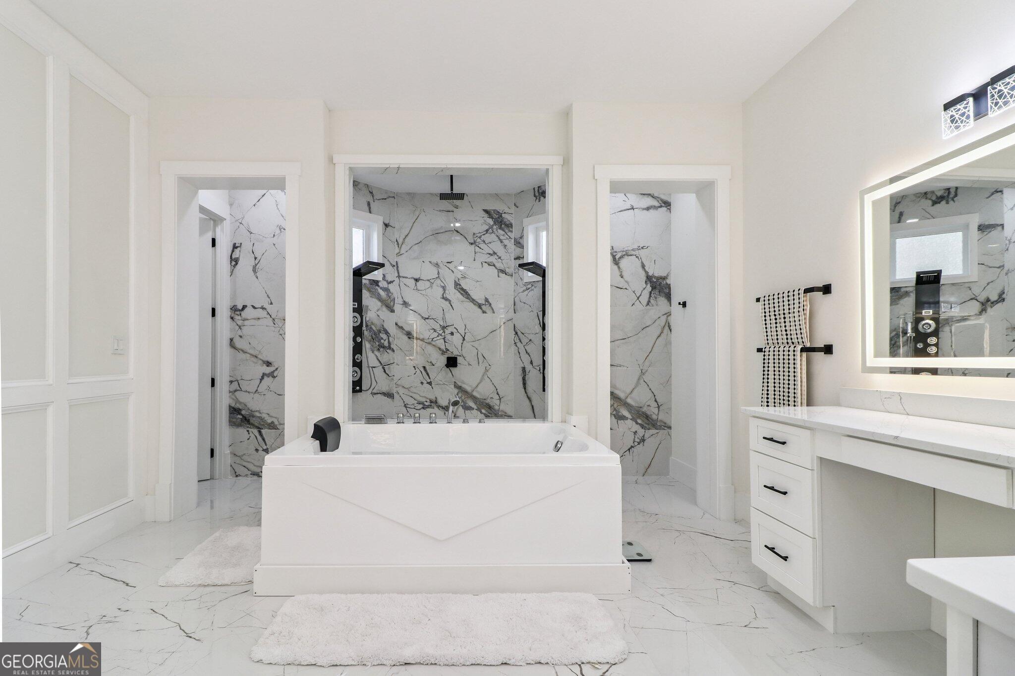 4032 Wesley Chapel Road Roswell, GA 30075 - Photo 12 of 36 a bathroom with a bathtub and a shower