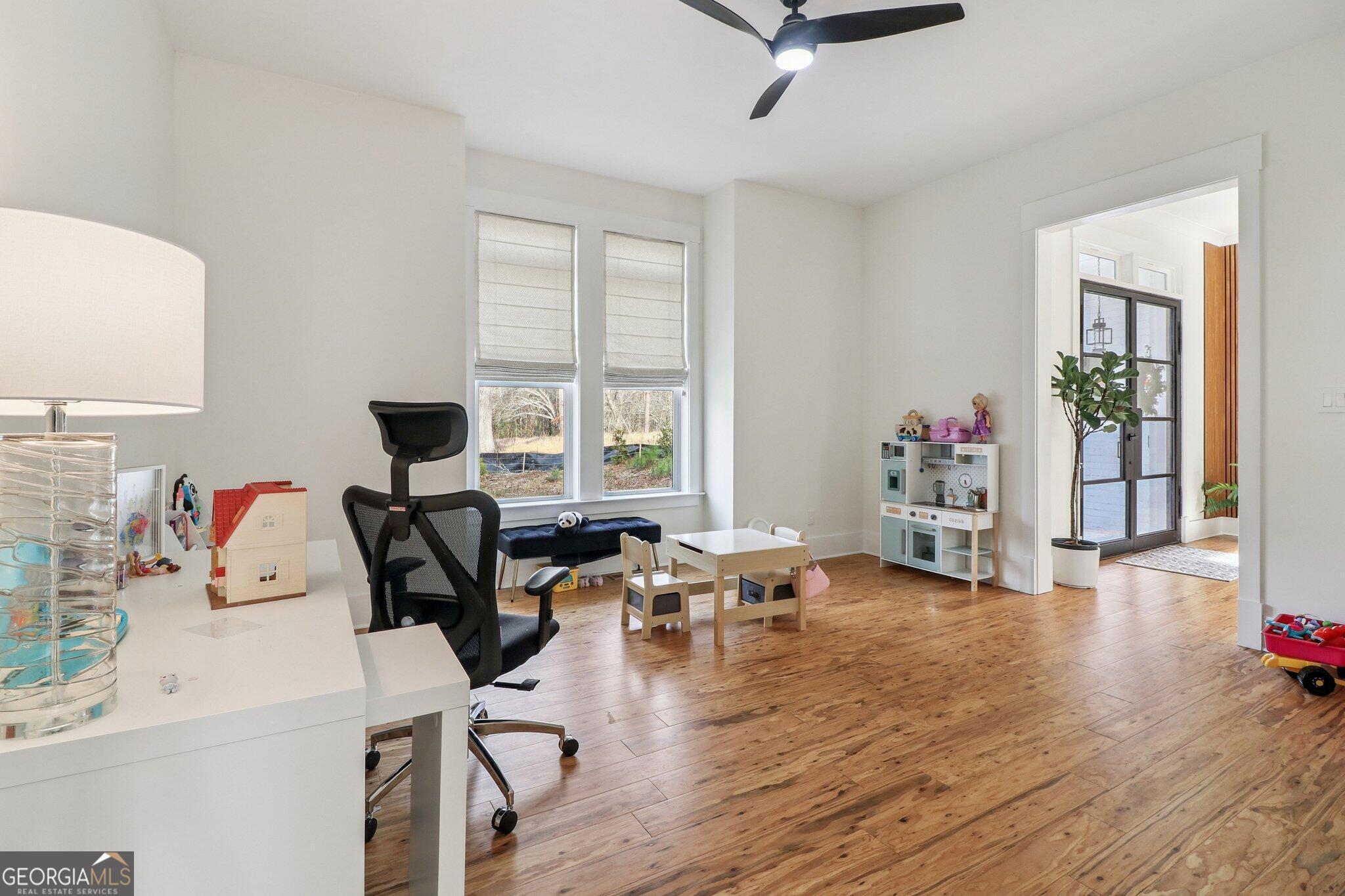 4032 Wesley Chapel Road Roswell, GA 30075 - Photo 17 of 36 a living room with furniture and a wooden floor