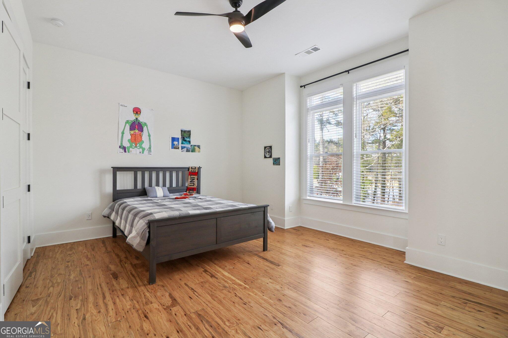 4032 Wesley Chapel Road Roswell, GA 30075 - Photo 18 of 36 a bedroom with a bed and a large window