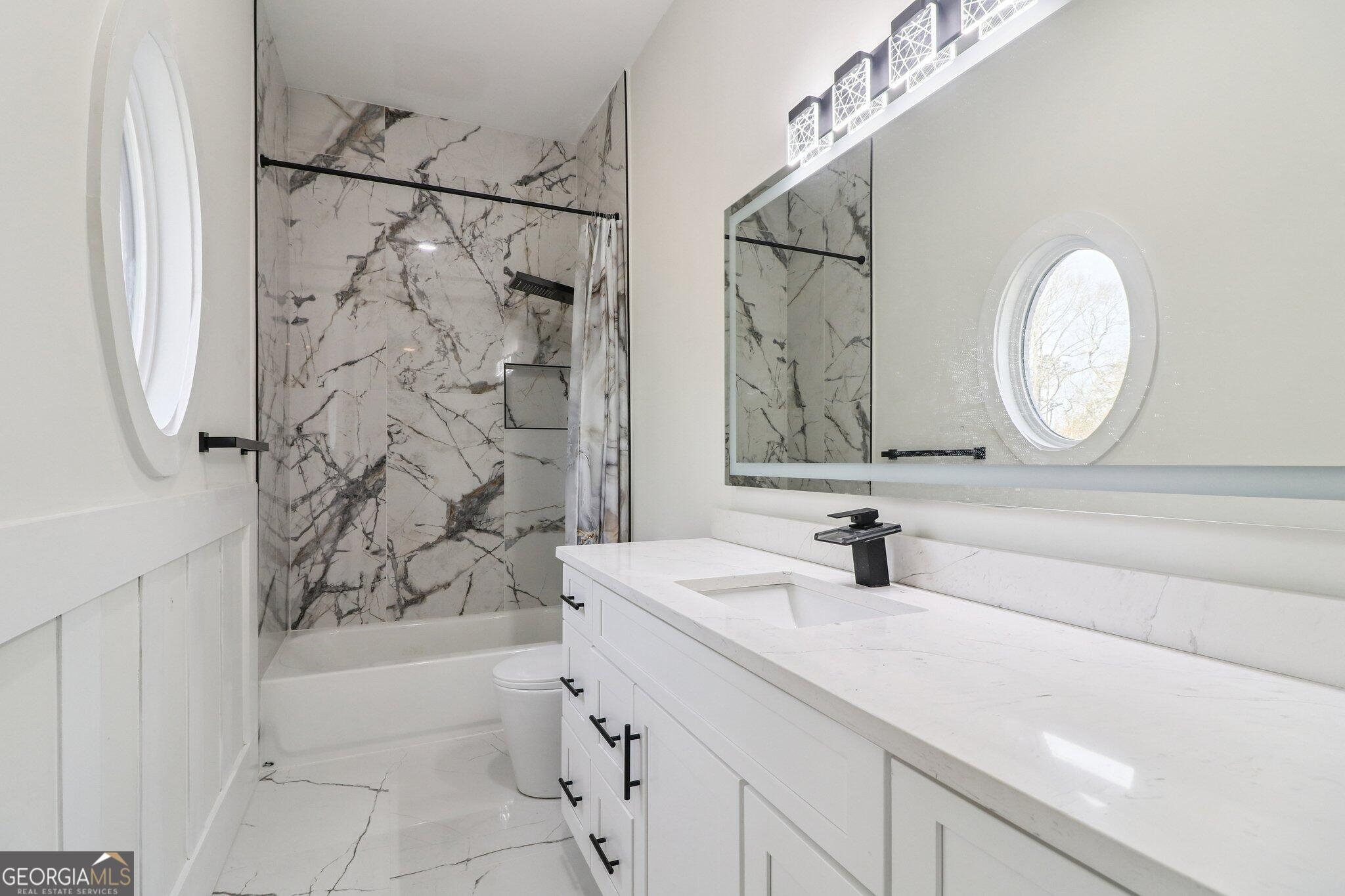 4032 Wesley Chapel Road Roswell, GA 30075 - Photo 19 of 36 a bathroom with a mirror sink and vanity