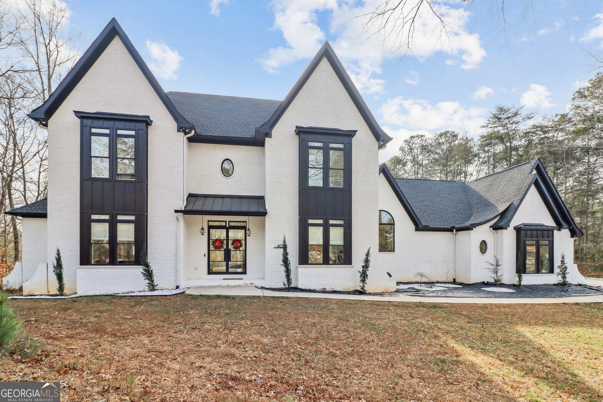 4032 Wesley Chapel Road Roswell, GA 30075 - Photo 2 of 36 a front view of a house with garden