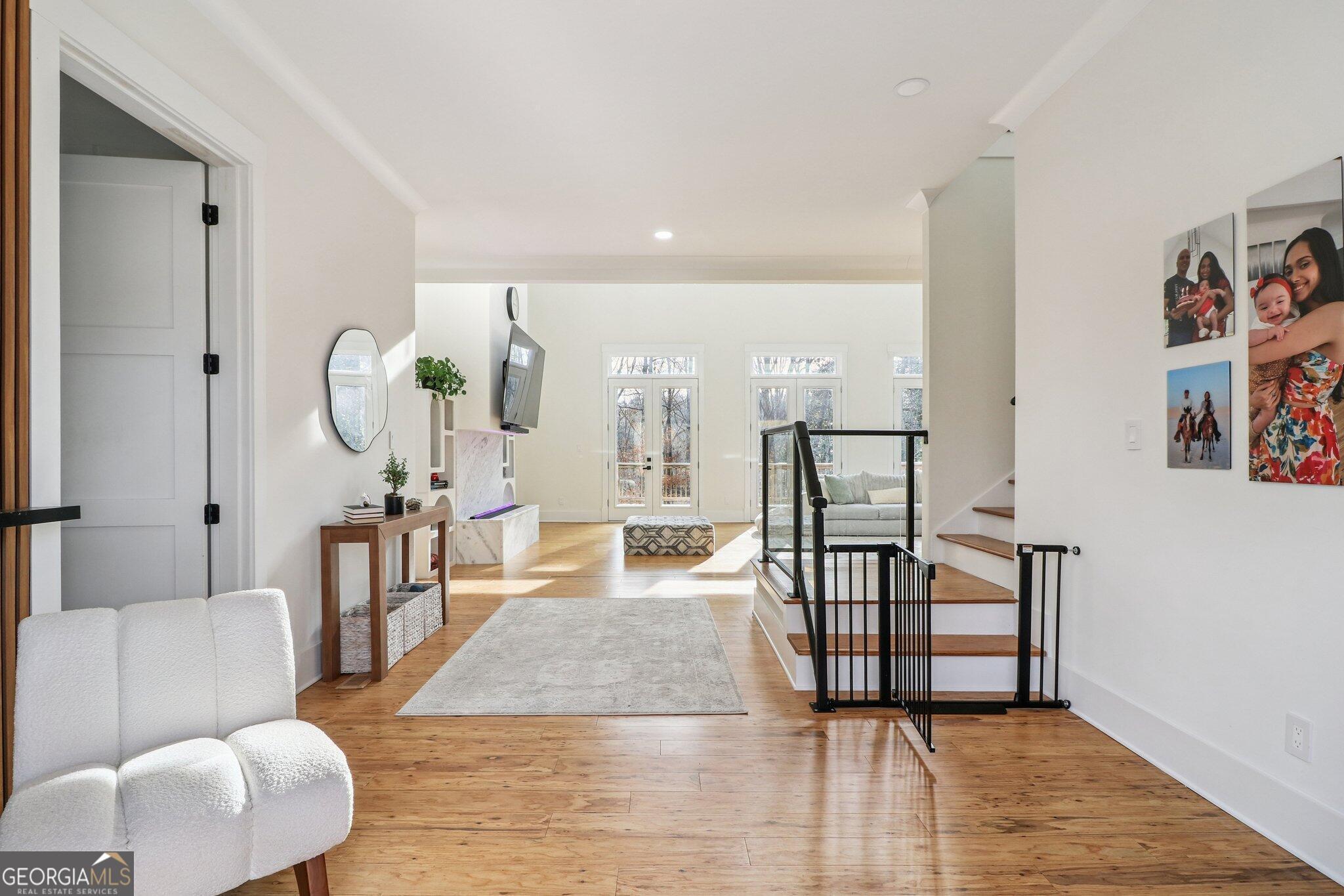 4032 Wesley Chapel Road Roswell, GA 30075 - Photo 21 of 36 a living room with fireplace furniture and a wooden floor