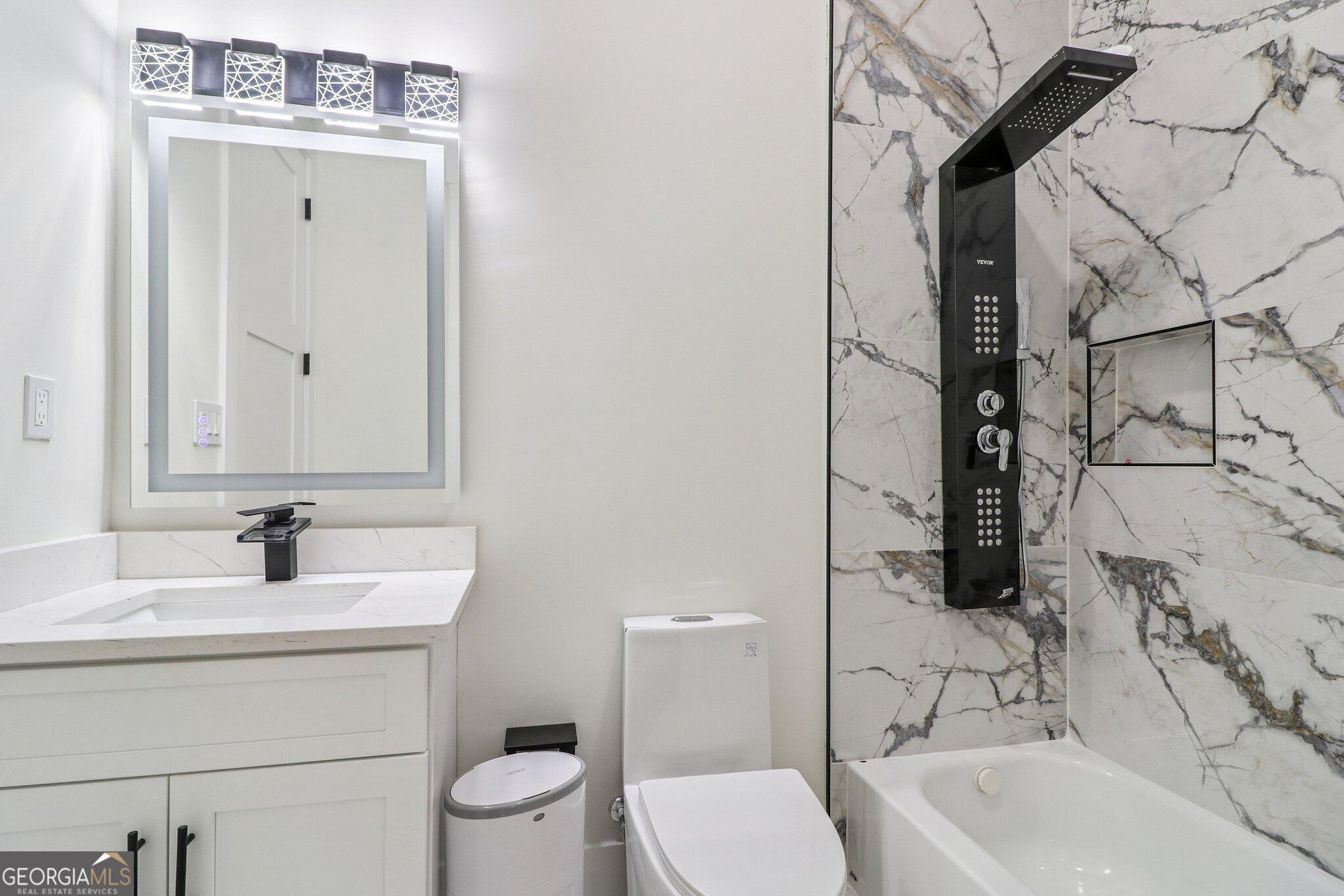 4032 Wesley Chapel Road Roswell, GA 30075 - Photo 24 of 36 a bathroom with a sink a toilet and shower