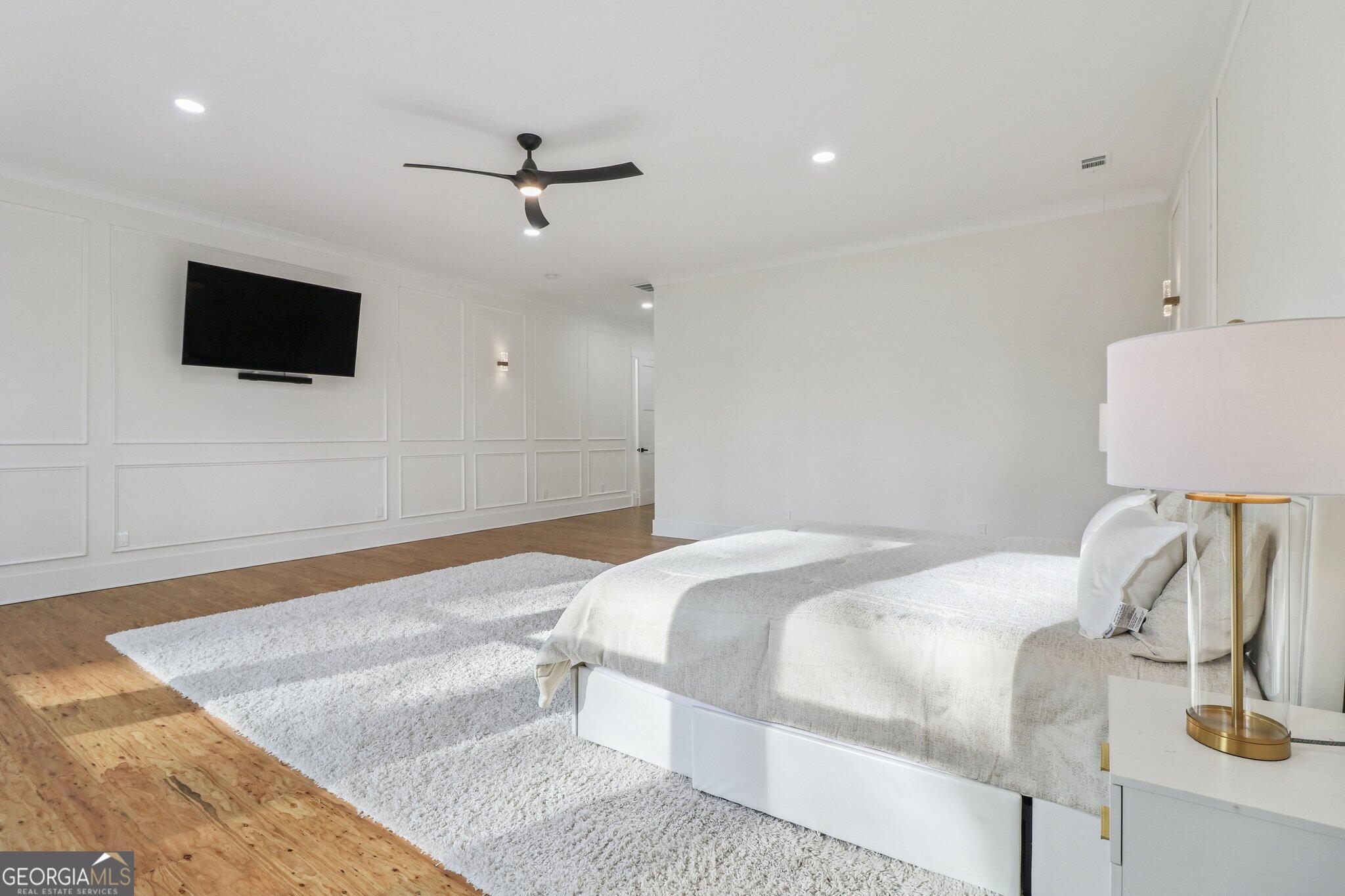 4032 Wesley Chapel Road Roswell, GA 30075 - Photo 25 of 36 a bedroom with a bed and a flat screen tv