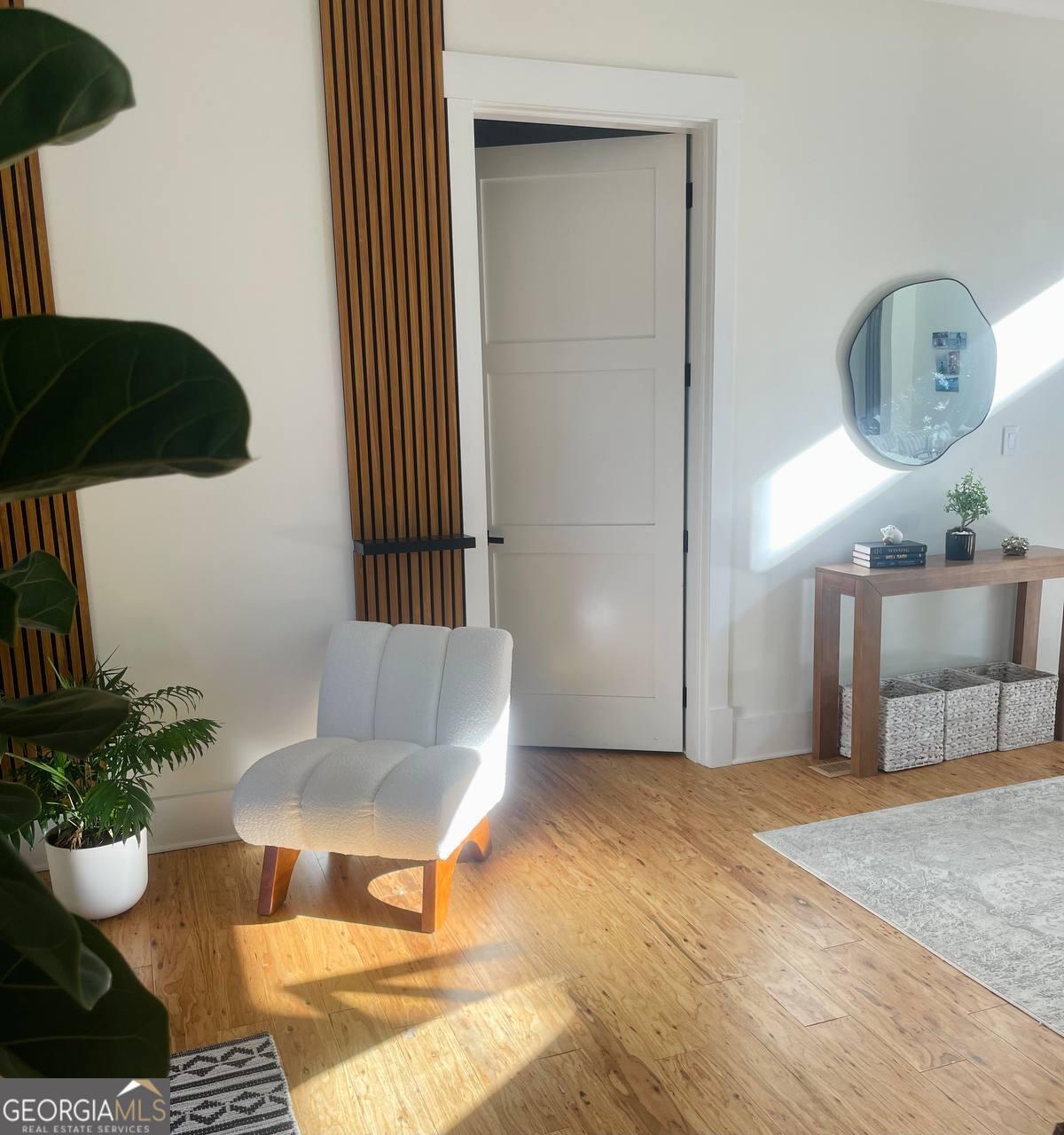 4032 Wesley Chapel Road Roswell, GA 30075 - Photo 29 of 36 a living room with furniture and a potted plant