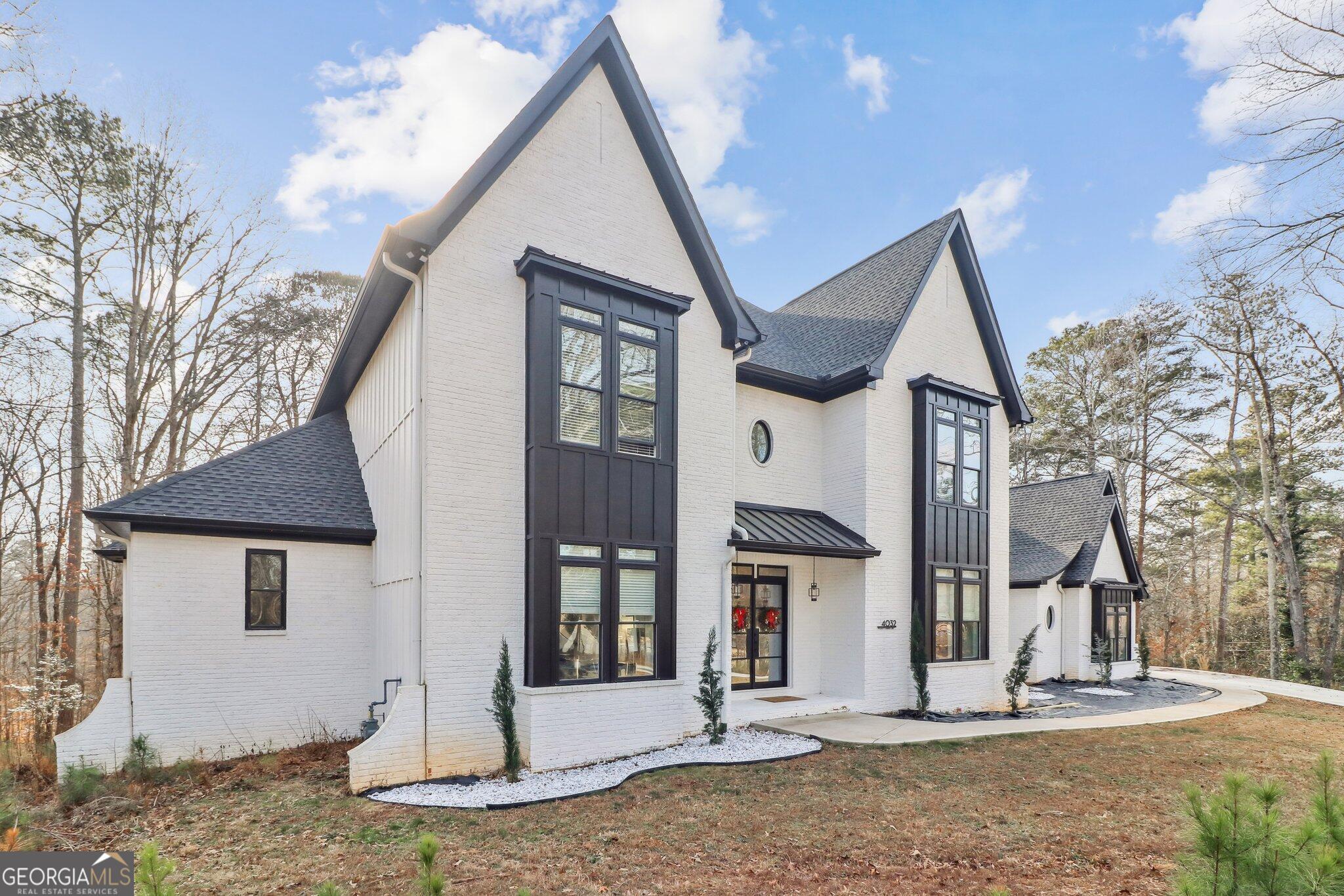 4032 Wesley Chapel Road Roswell, GA 30075 - Photo 3 of 36 a front view of a house with a pathway