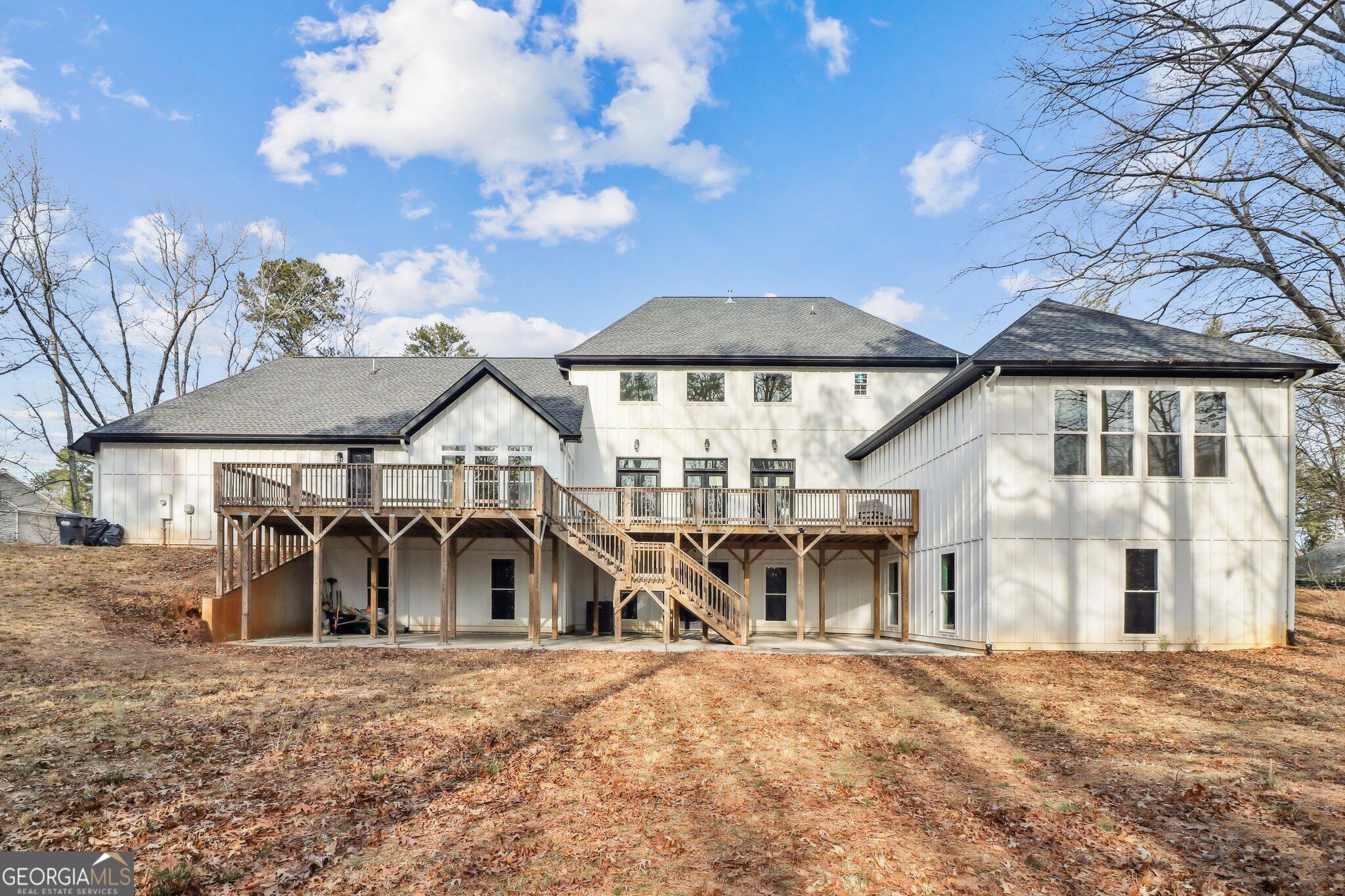 4032 Wesley Chapel Road Roswell, GA 30075 - Photo 5 of 36 a front view of a house with a yard and garage