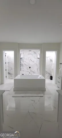 a view of spacious bedroom with a large window