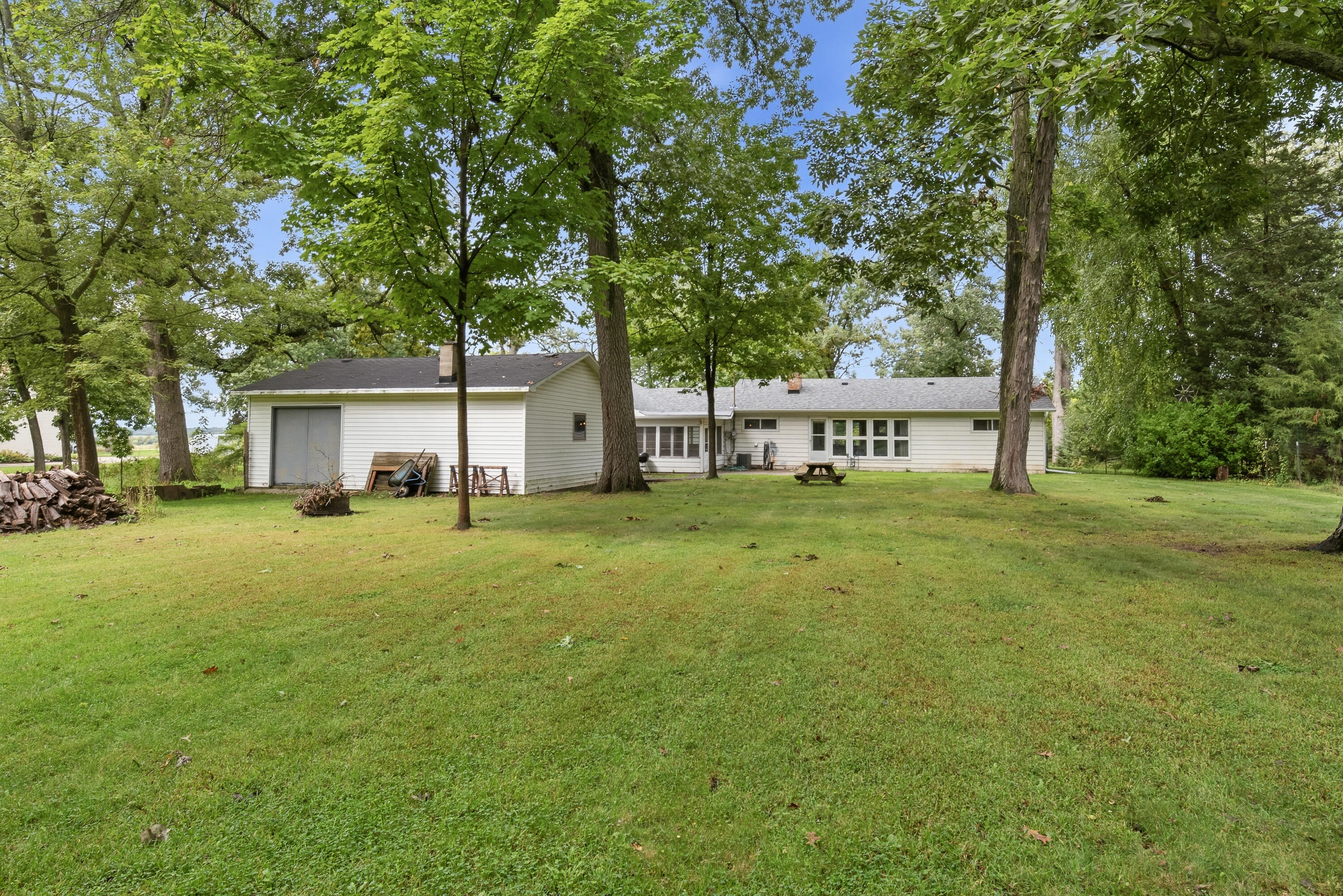 4939 Mound Road Elkhorn, WI 53121 - Photo 3 of 38 Beautiful backyard setting with plenty of space to enjoy the outdoors, entertain, garden or simply relax at home