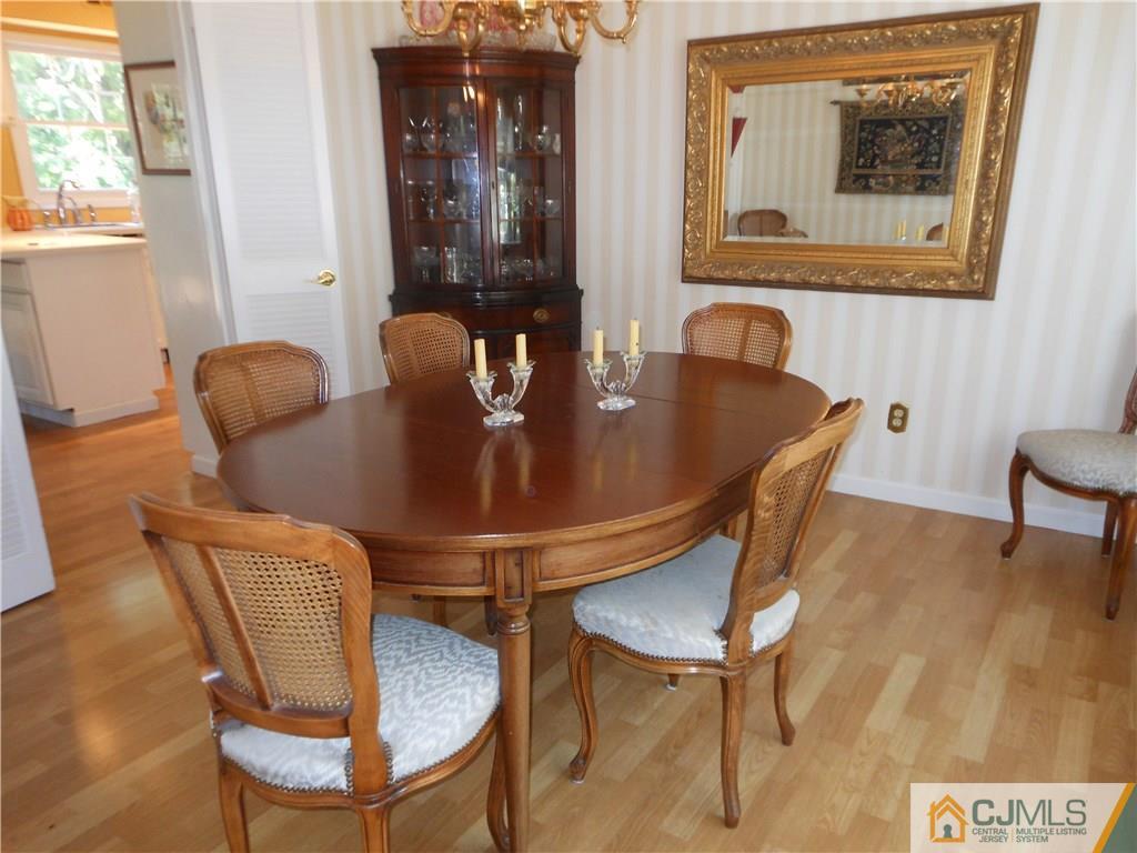 34 MacAfee Road Somerset, NJ 08873 - Photo 4 of 17 a view of a dining room with furniture and wooden floor