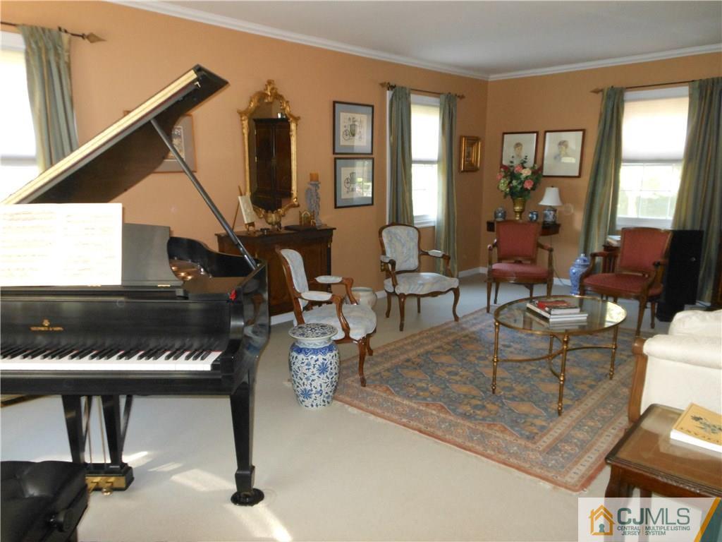 34 MacAfee Road Somerset, NJ 08873 - Photo 5 of 17 a living room with furniture a piano and a floor to ceiling window