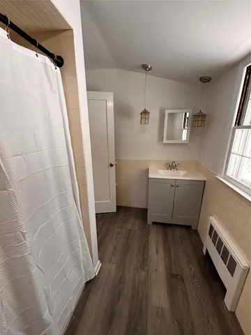 a bathroom with a sink and mirror