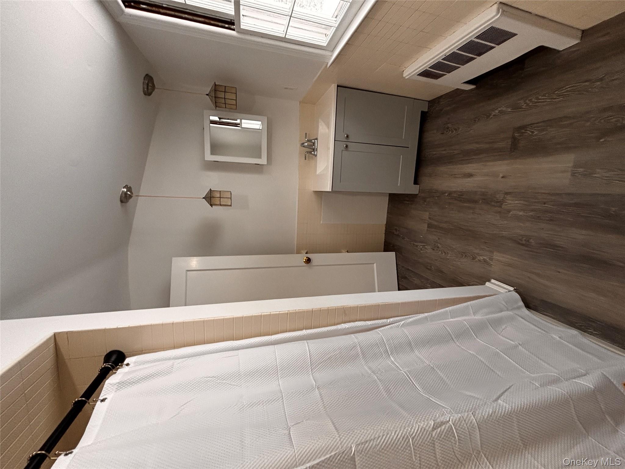 67 Turkey Lane Cold Spring Harbor, NY 11724 - Photo 15 of 18 a bathroom with a sink and mirror