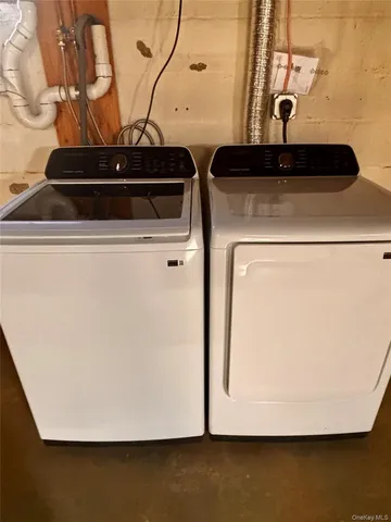 a close view of sink a washer and dryer