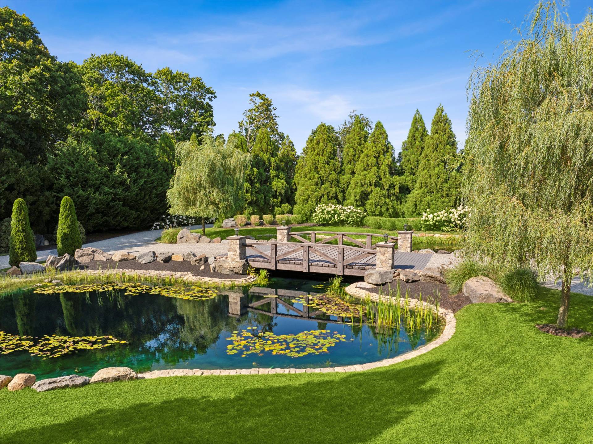 254 Mitchell Lane Bridgehampton, NY 11932 - Photo 2 of 36 a view of a swimming pool with a yard