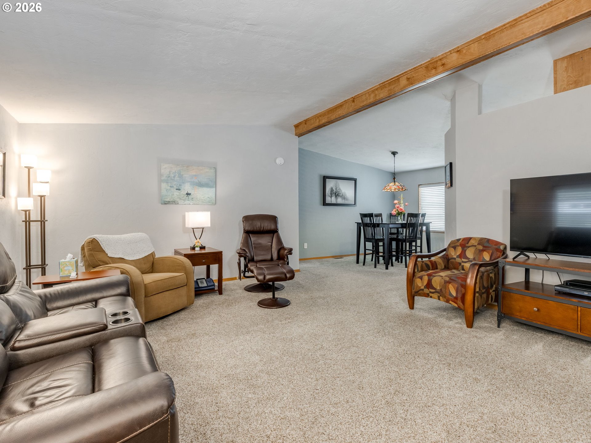 4730 Auburn Road Northeast, Unit 125 Salem, OR 97301 - Photo 35 of 36 a living room with furniture and a flat screen tv