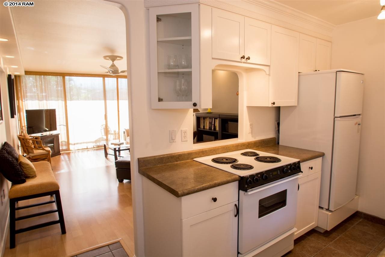 2219 South Kihei Road, Unit B214 Kihei, HI 96753 - Photo 11 of 20 a kitchen with sink stove and refrigerator
