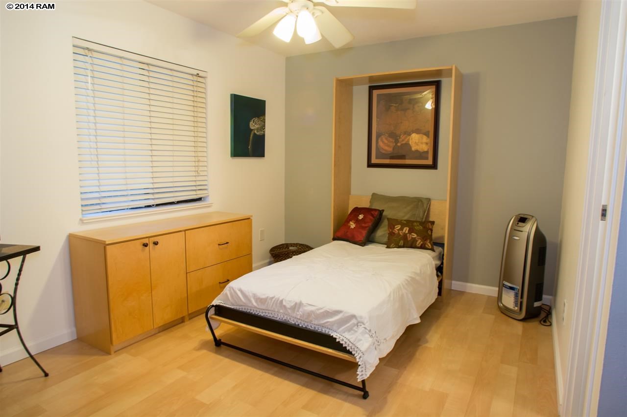 2219 South Kihei Road, Unit B214 Kihei, HI 96753 - Photo 18 of 20 a bedroom with a bed and a window