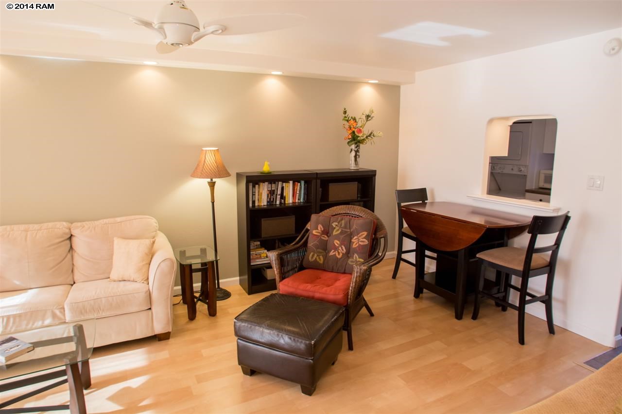 2219 South Kihei Road, Unit B214 Kihei, HI 96753 - Photo 6 of 20 a living room with furniture and a rug