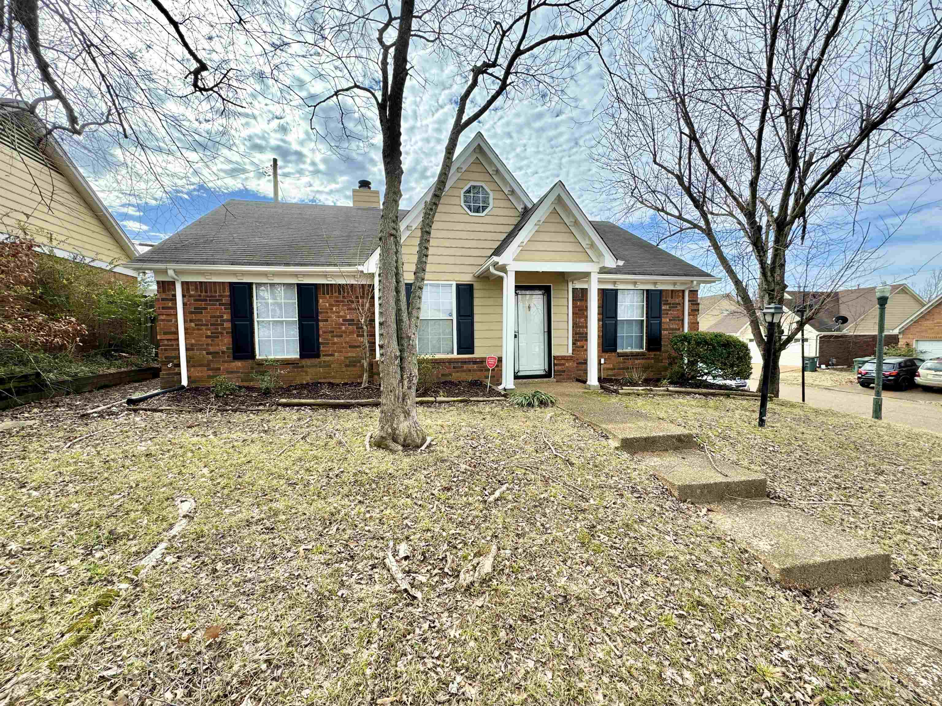 8373 Old Dexter Road Memphis, TN 38016 - Photo 2 of 26 View of front of house with brick siding and a chimney