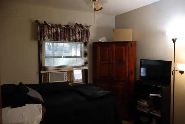 a kitchen with a refrigerator and window