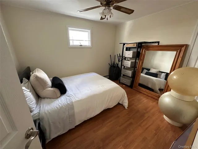 a bedroom with a bed and cabinets
