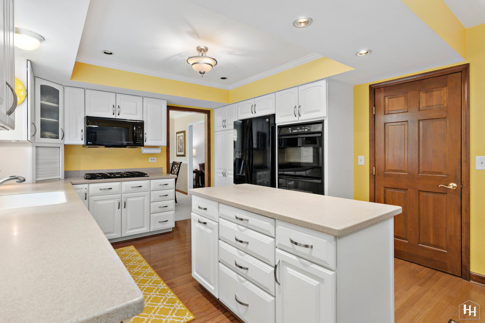 2275 Tara Drive Elgin, IL 60123 - Photo 12 of 33 a large white kitchen with a stove top oven a sink and dishwasher