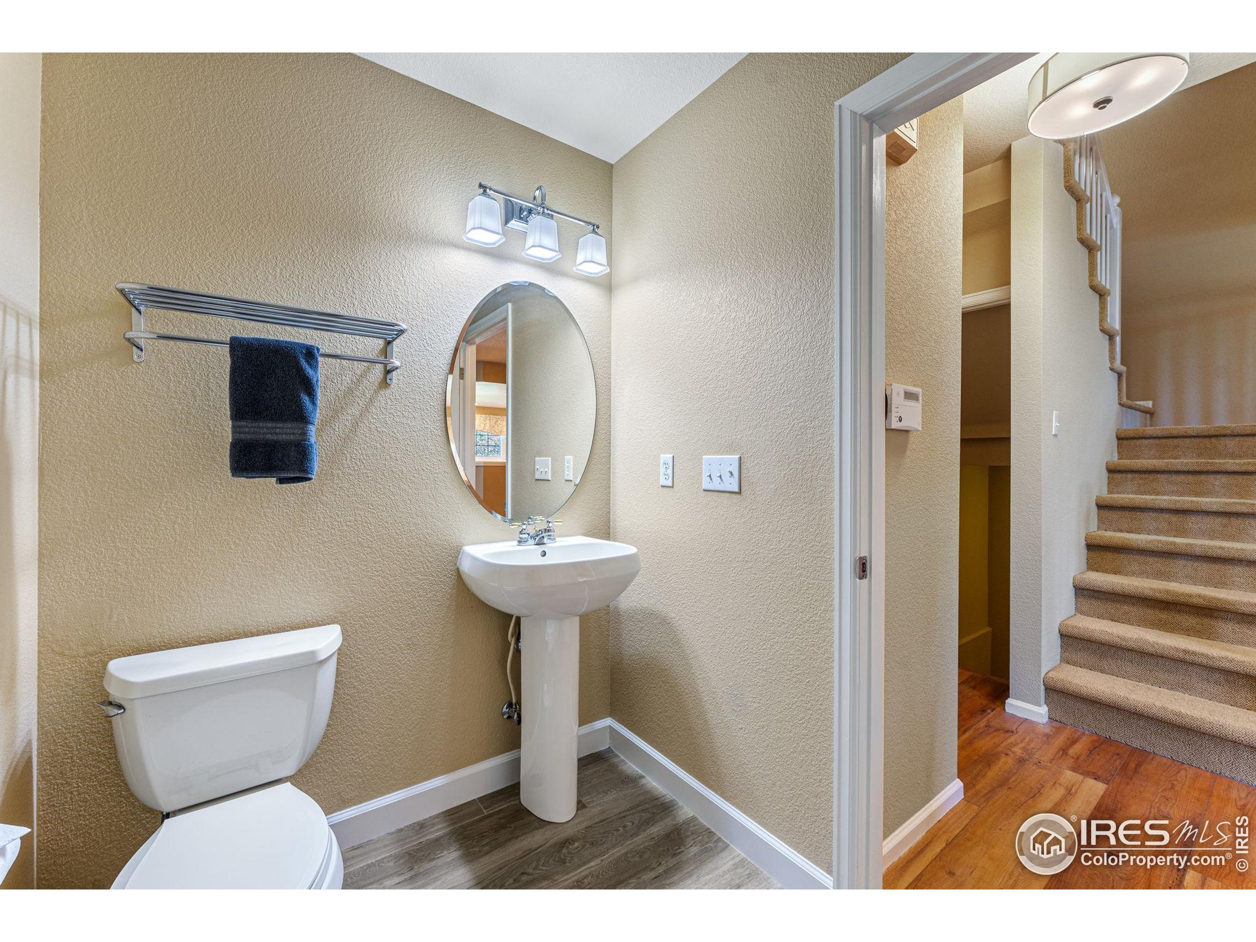 41 Quince Street Denver, CO 80230 - Photo 15 of 48 a bathroom with a toilet and a mirror