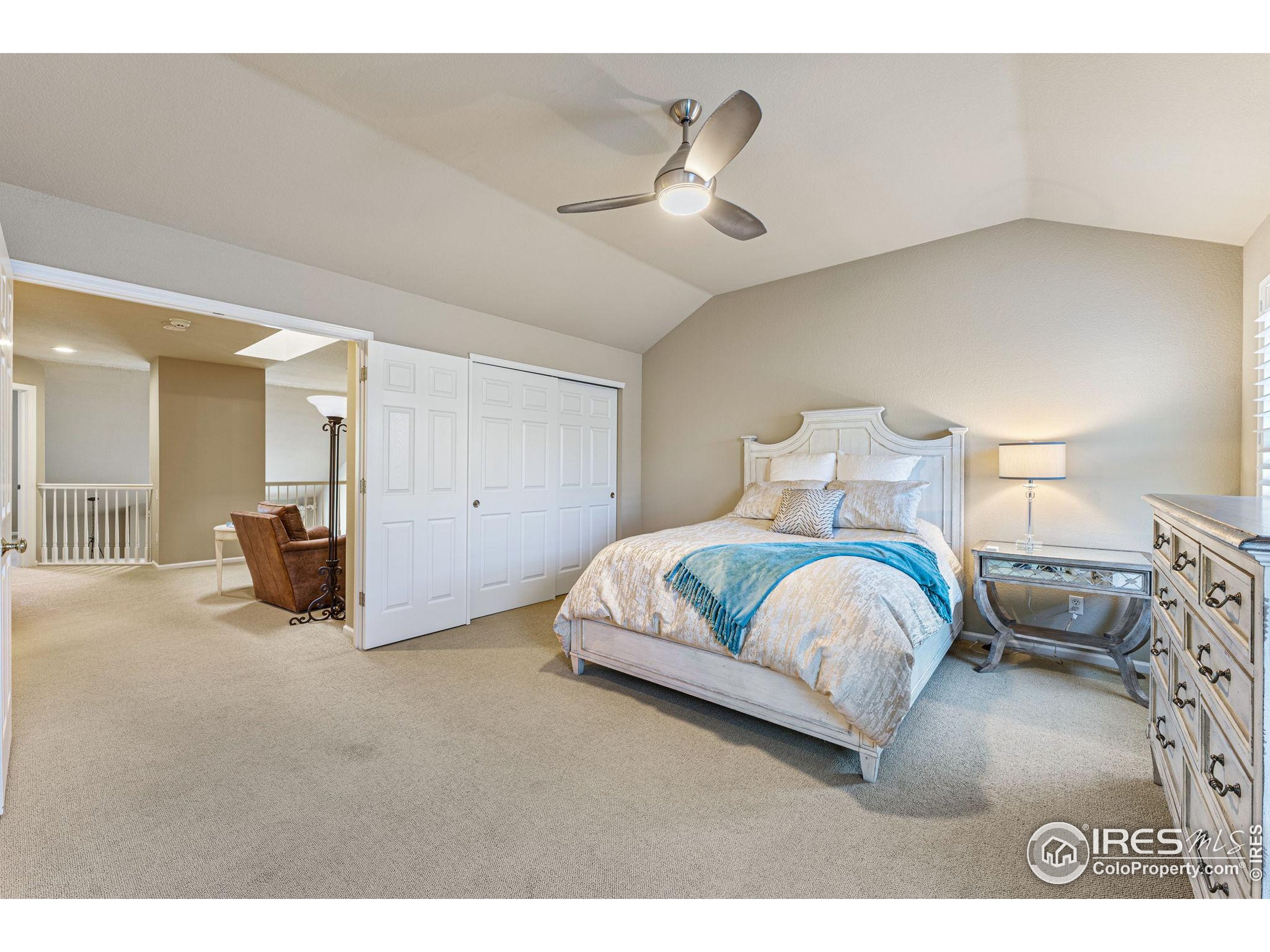 41 Quince Street Denver, CO 80230 - Photo 16 of 48 a spacious bedroom with a bed and ceiling fan