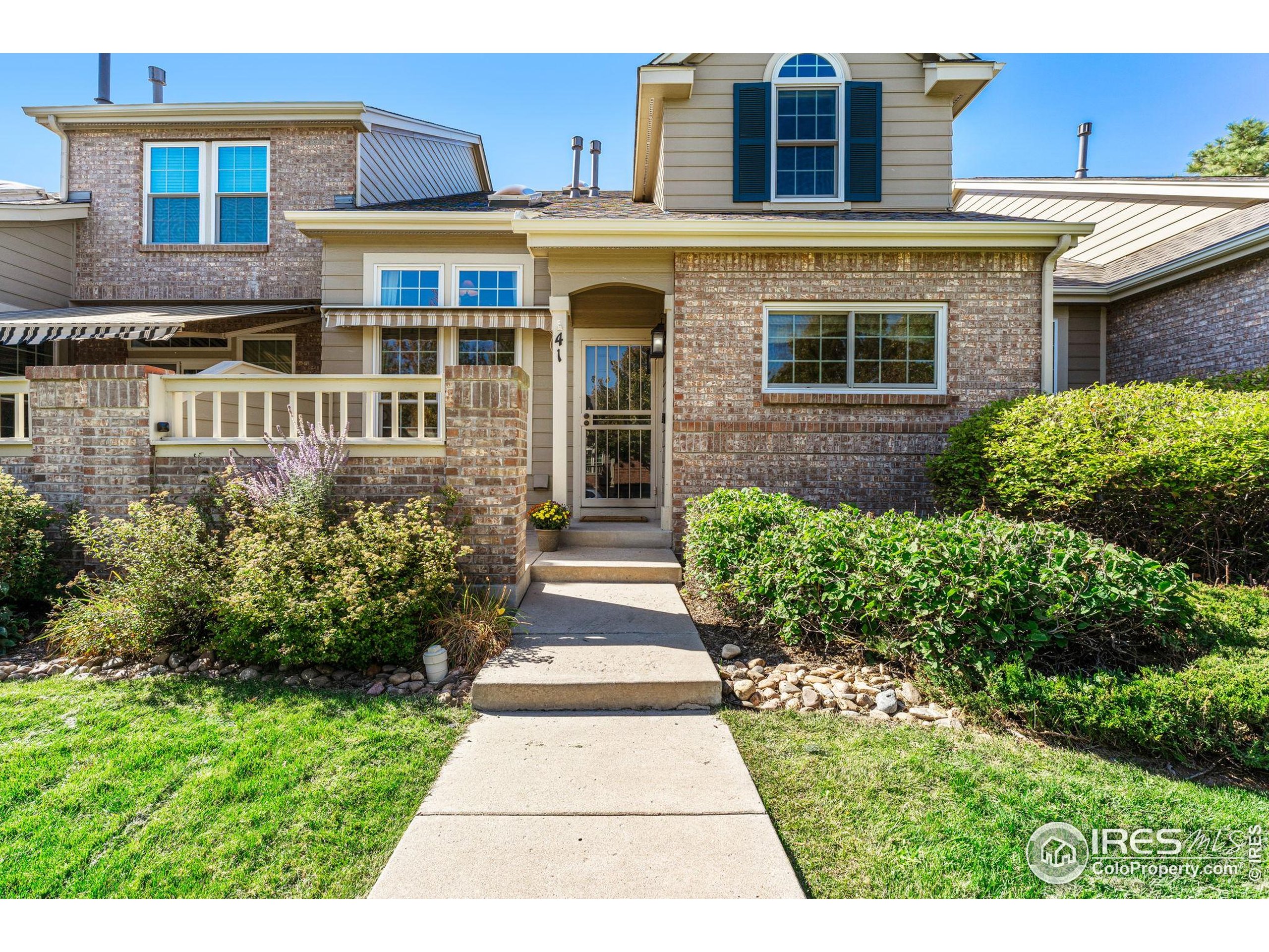 41 Quince Street Denver, CO 80230 - Photo 2 of 48 a view of a brick house with a yard