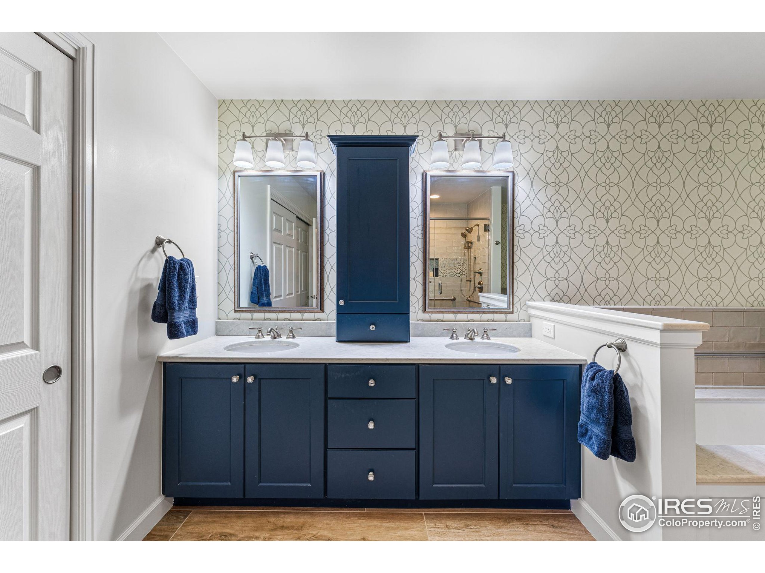 41 Quince Street Denver, CO 80230 - Photo 21 of 48 a bathroom with a sink and a mirror