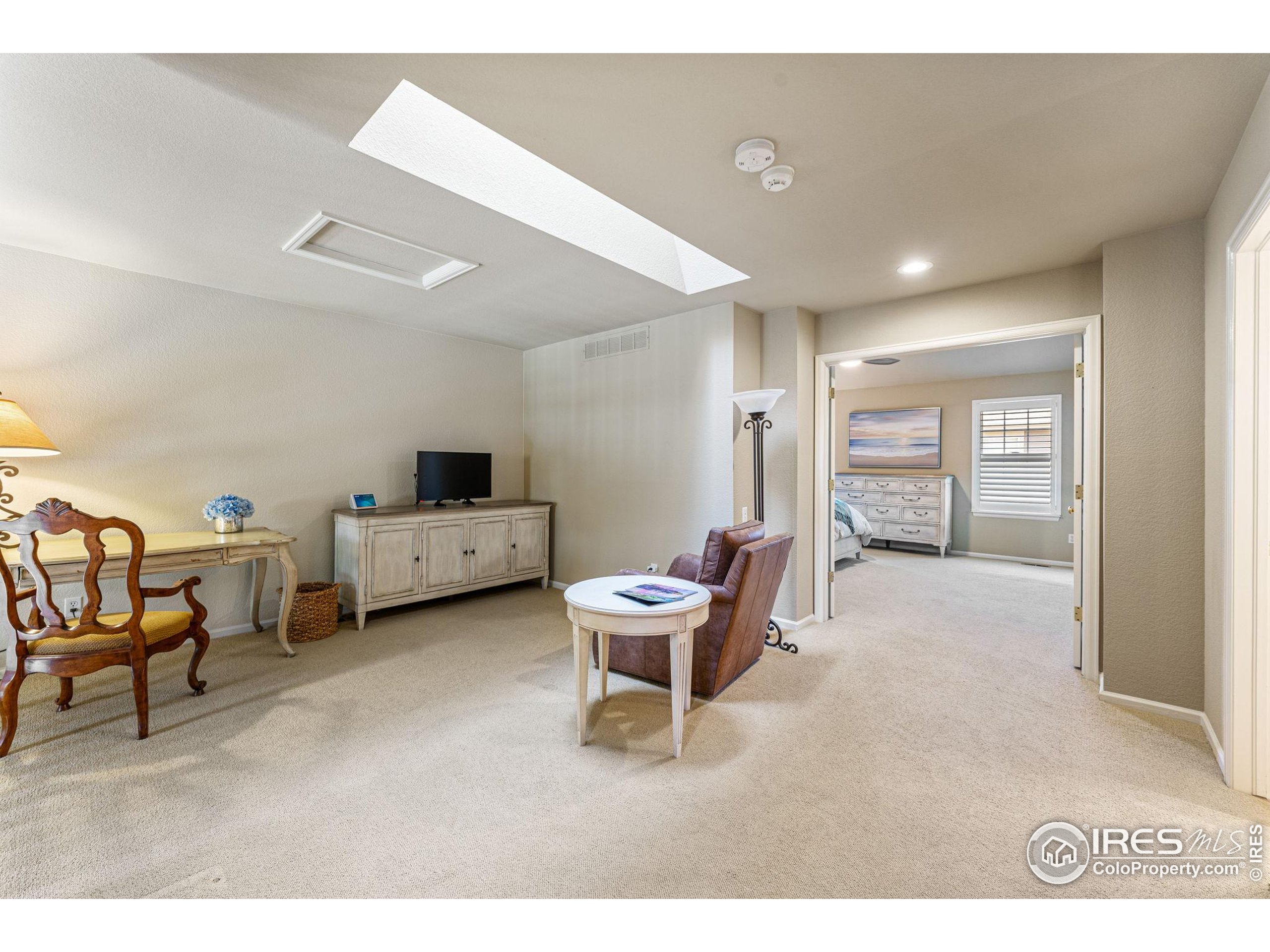41 Quince Street Denver, CO 80230 - Photo 25 of 48 a living room with furniture and a chair