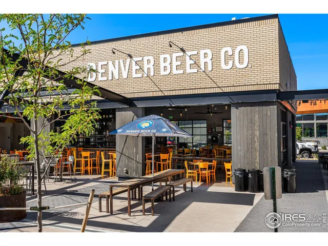 a view of a cafe with a couple of people seating
