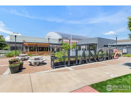 a view of a patio with couches and potted plants
