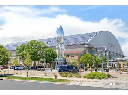 a view of a building with a garden